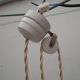 Old suspension, said rises and falls with serrated white opaline