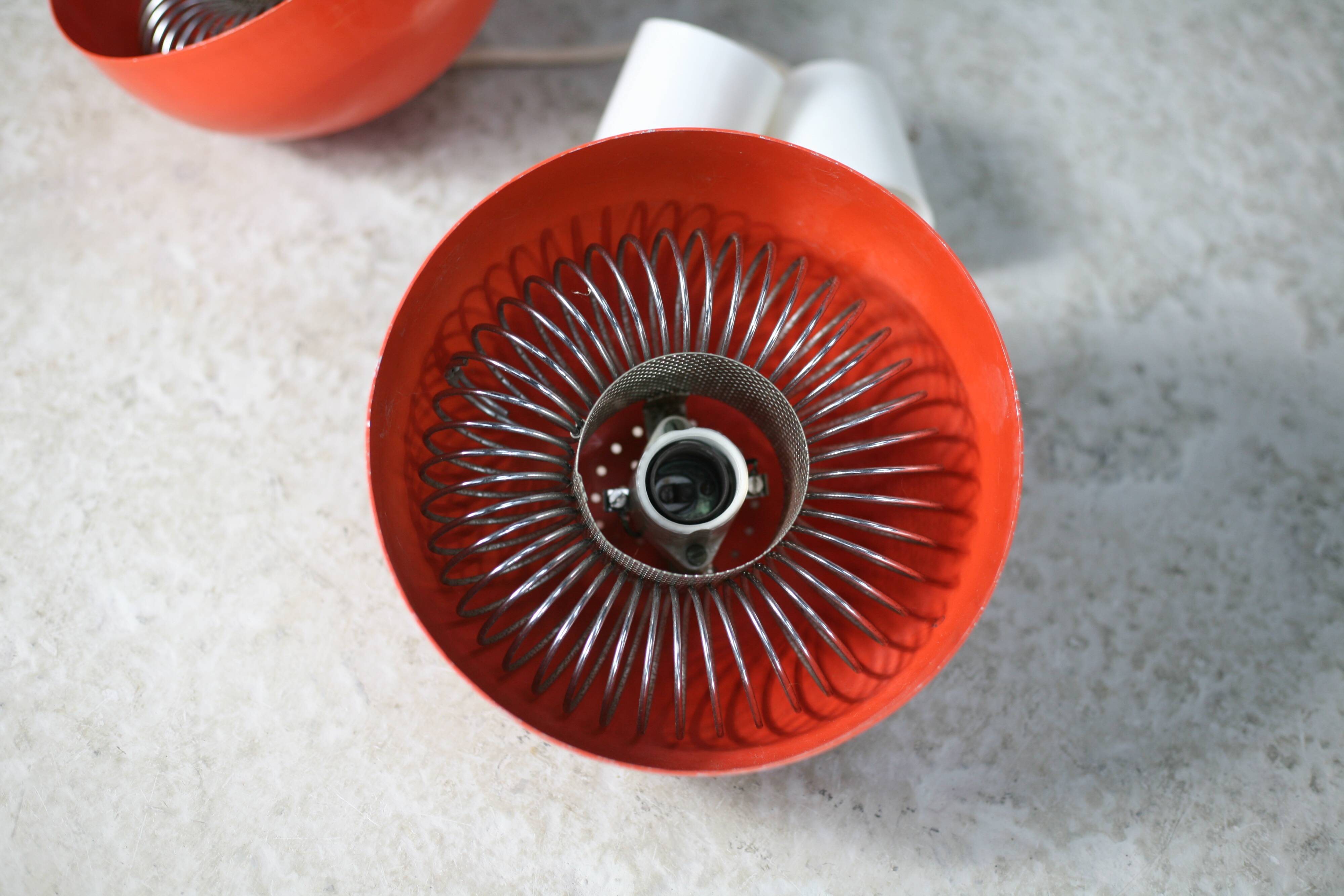 Set of 4 "spring" hanging lamps, orange steel, France, circa 1970