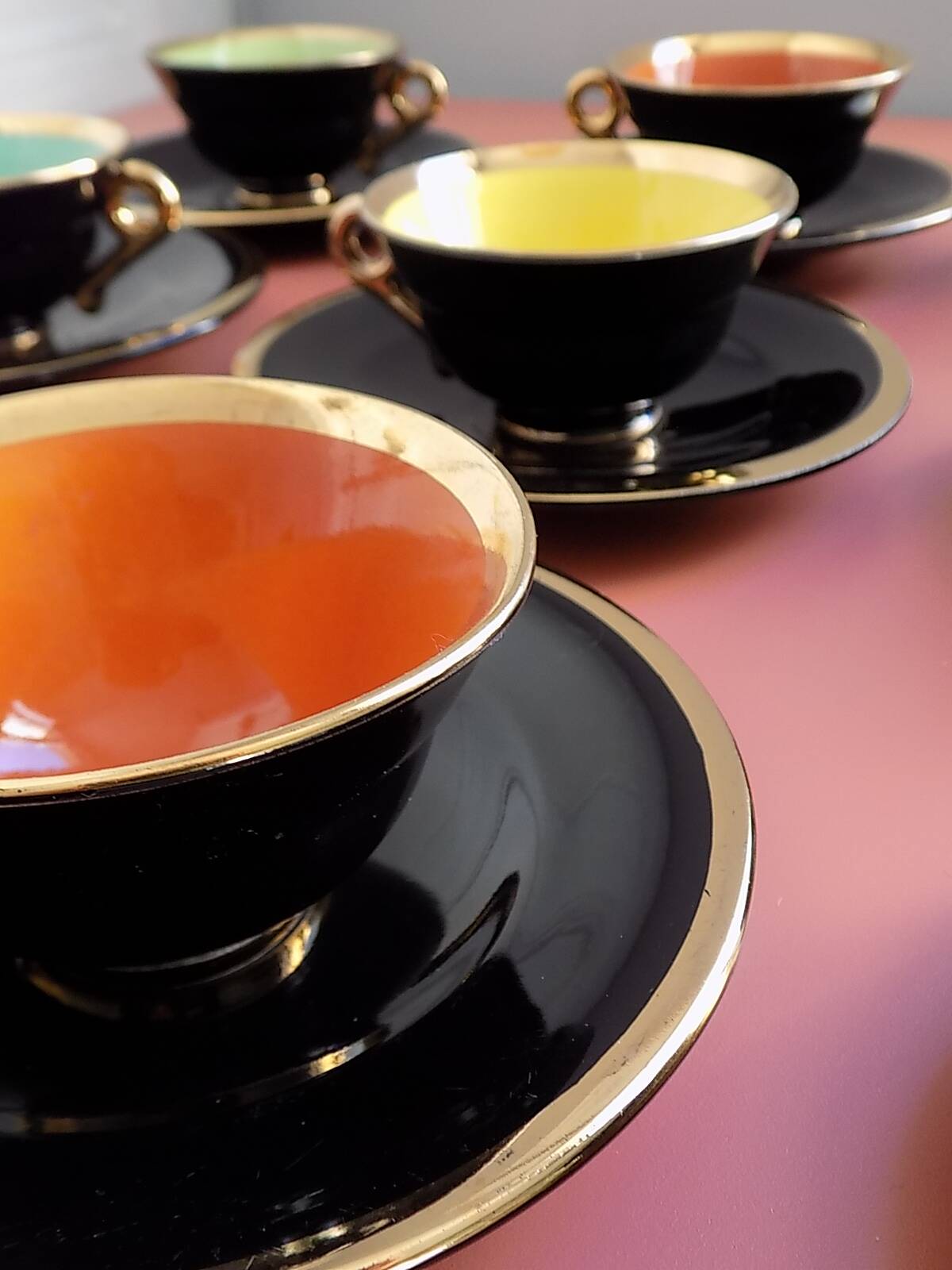 set of 9 black and gold Salins cups and saucers