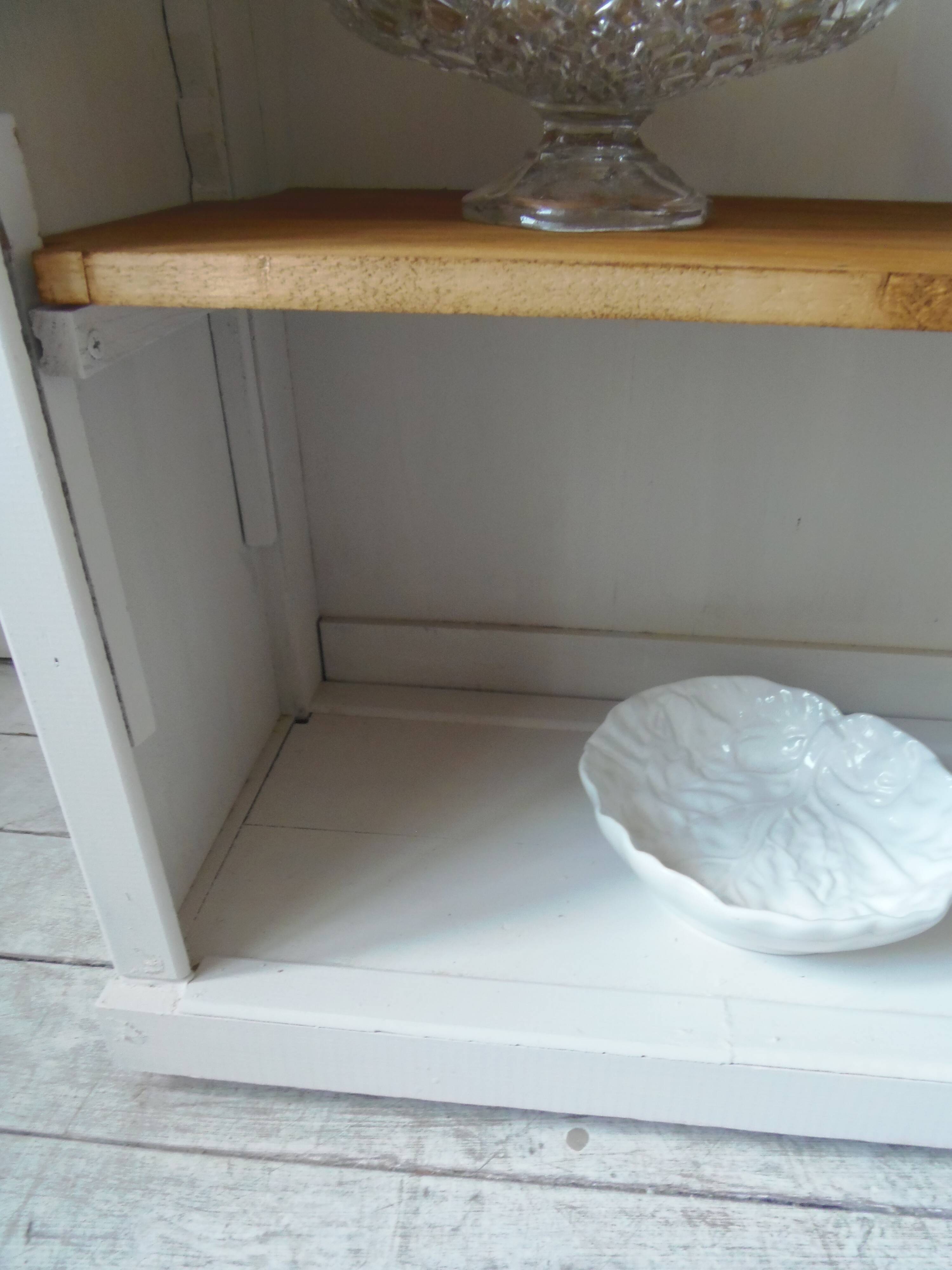 Shallow depth bookcase re-enchanted in pearl gray, wooden shelves.