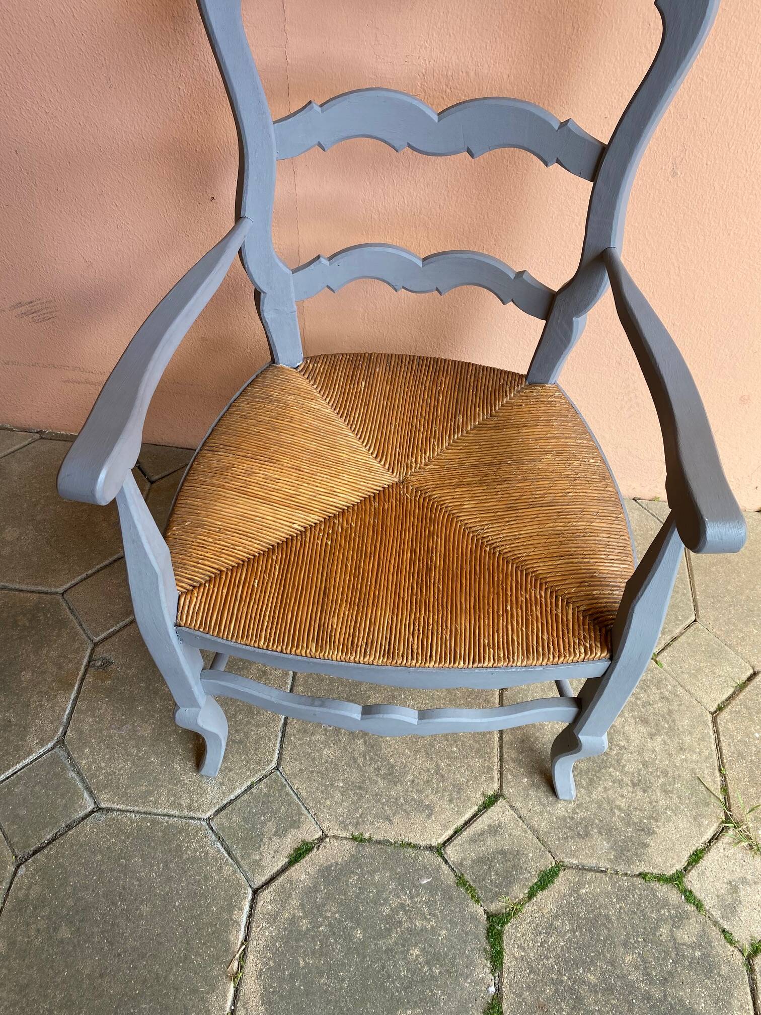Provencal style straw armchair with gray blue patina armrests