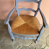 Provencal style straw armchair with gray blue patina armrests