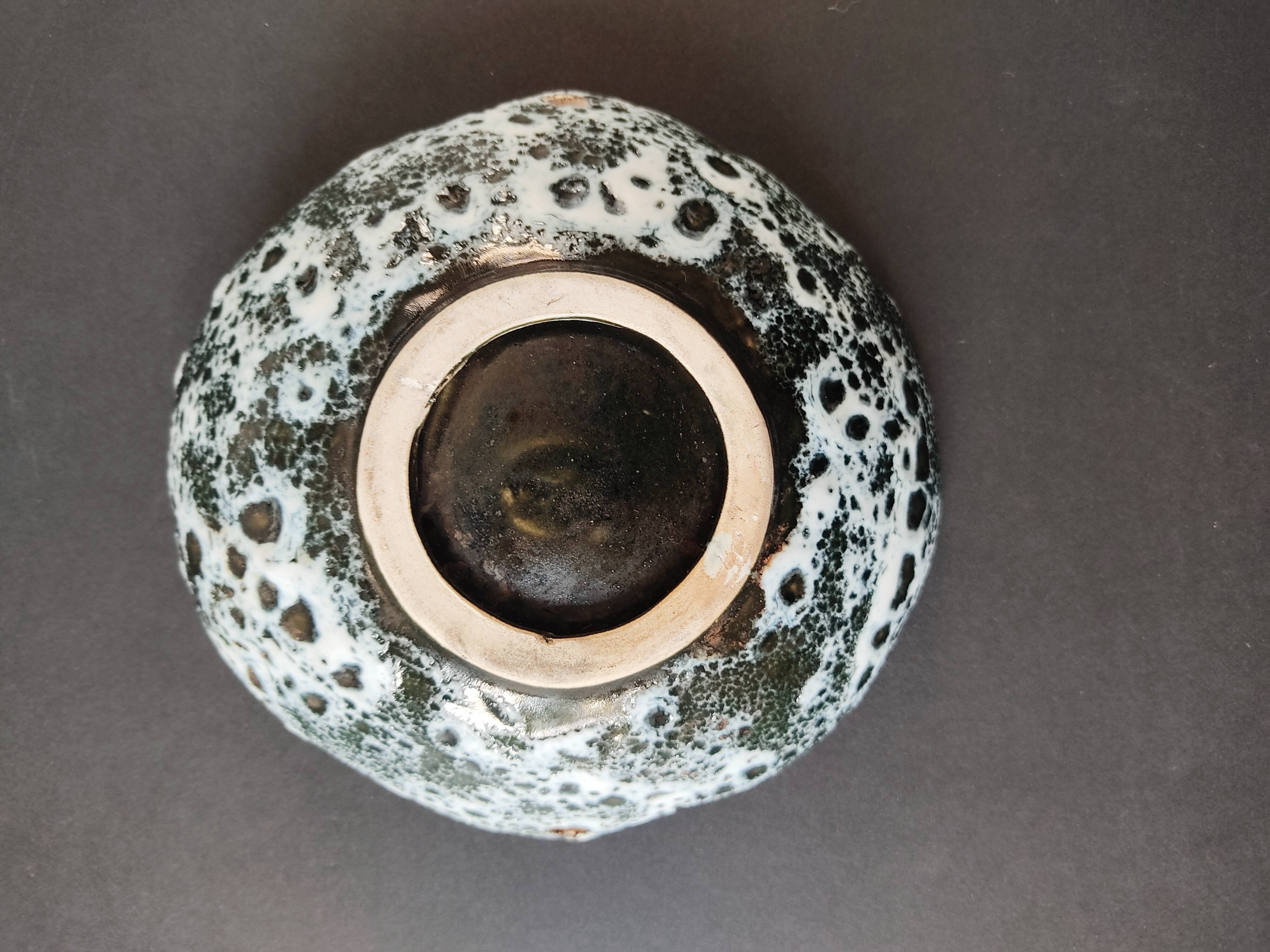 Empty black and white pocket with colored enamels