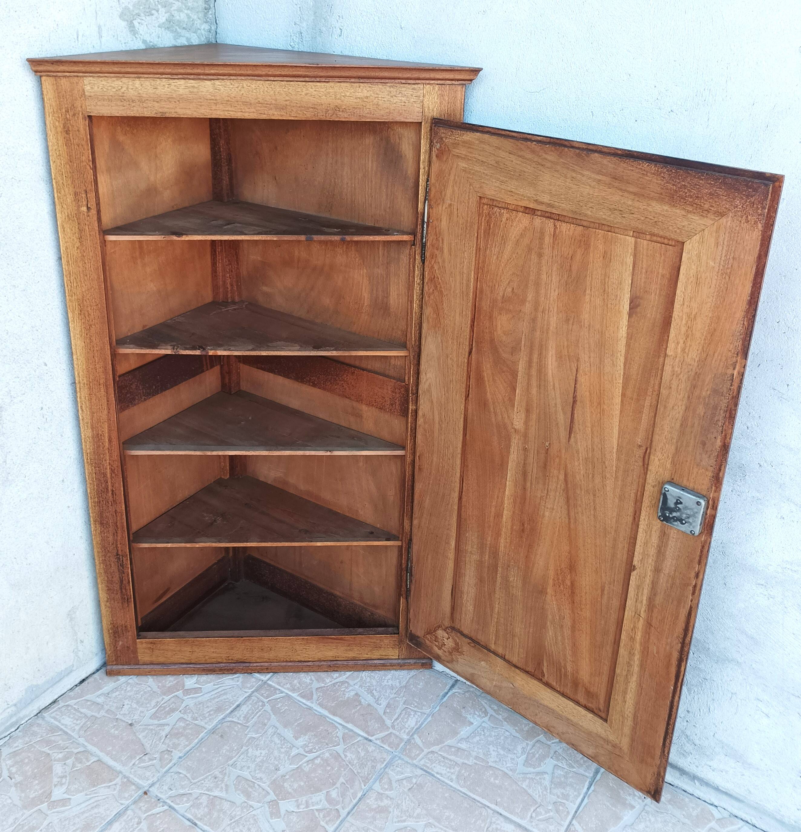 Corner cabinet in carved walnut, Savoyard style.