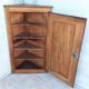 Corner cabinet in carved walnut, Savoyard style.
