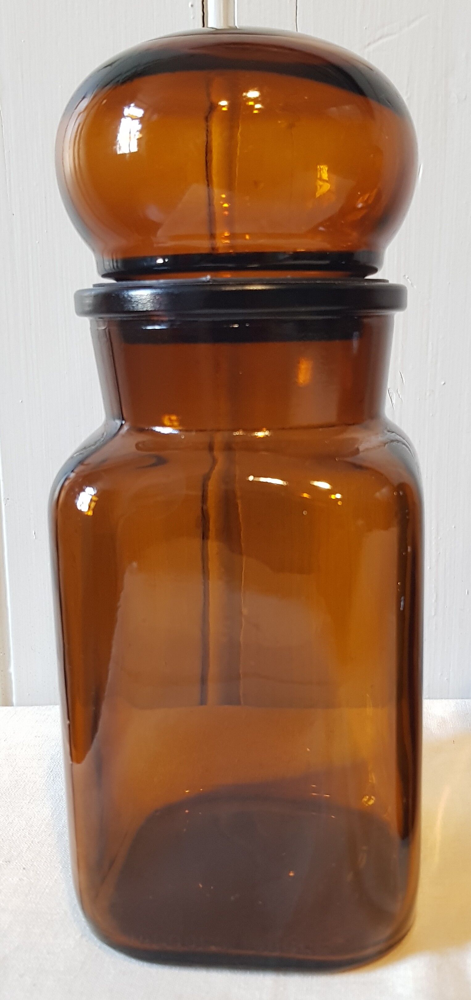 Series of 4  amber glass jars 70