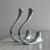 Pair of designer candlesticks in chromed metal