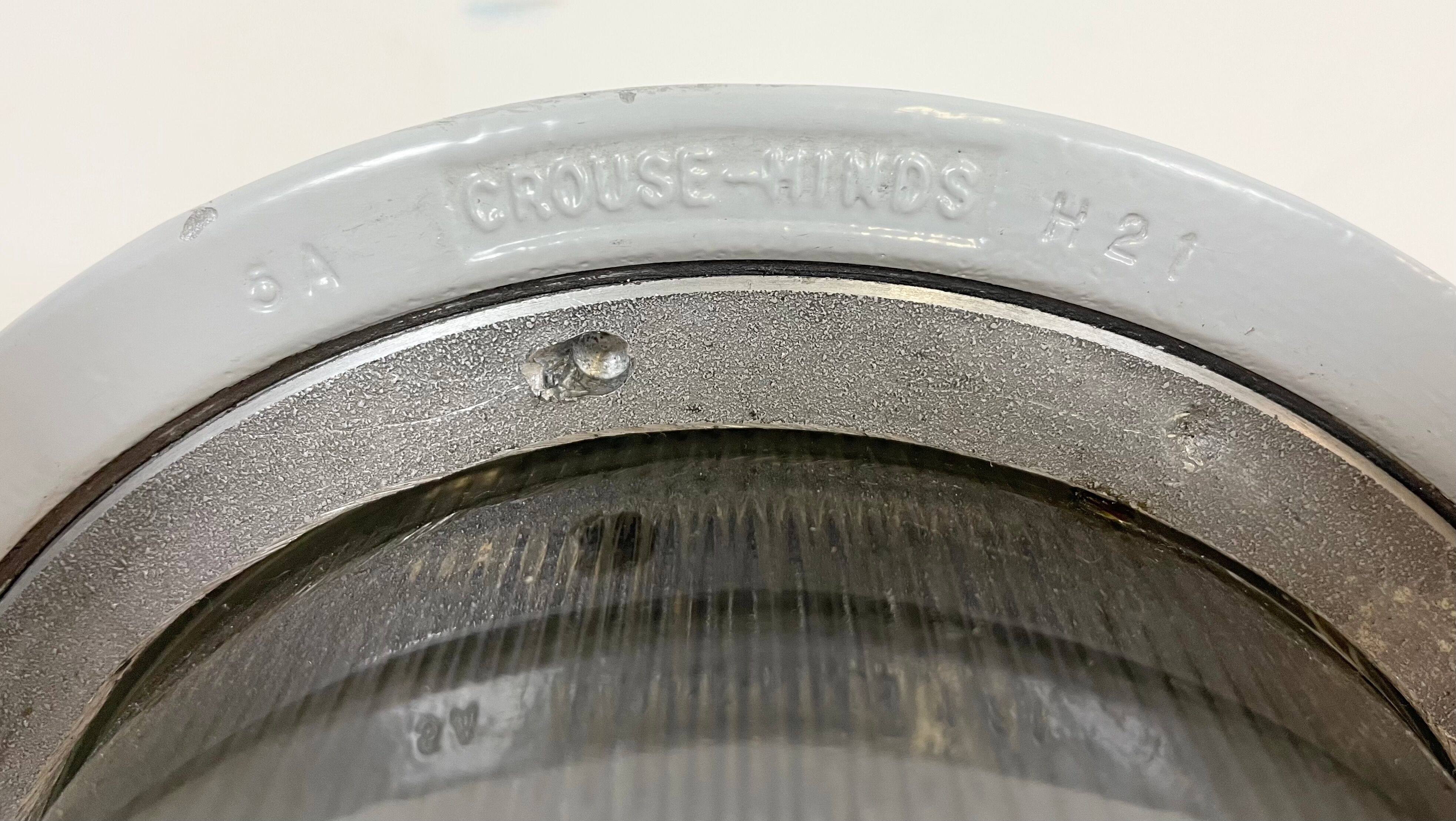 Grey industrial explosion proof light from Crouse-Hinds, 1970s
