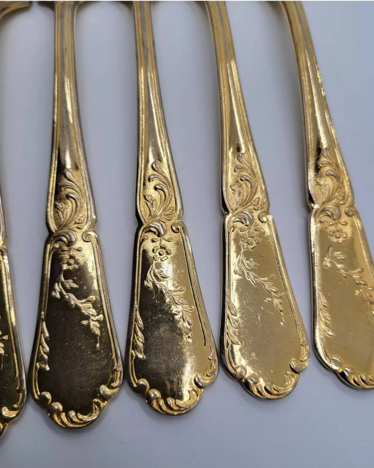 12 Table Forks in gold metal
