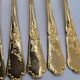 12 Table Forks in gold metal