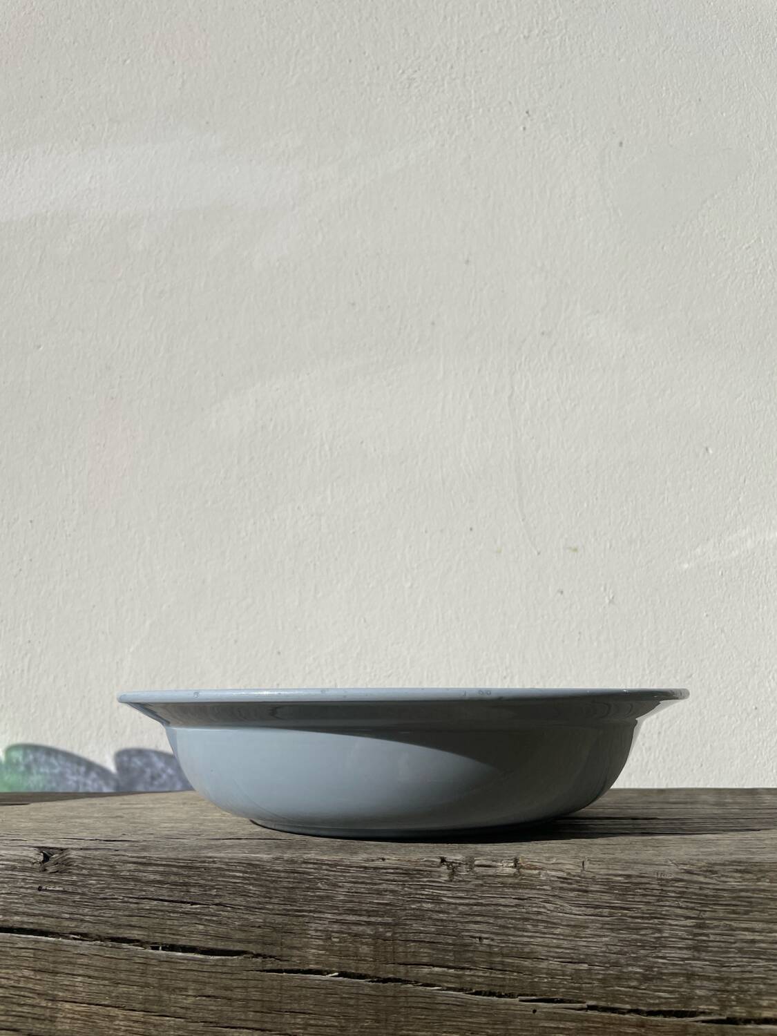 Round, flat, sky-blue ceramic salad bowl from Moulin des Loups