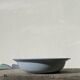 Round, flat, sky-blue ceramic salad bowl from Moulin des Loups