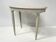Art Deco style guéridon in patinated beech, 20th century.