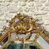 Mirror with parecloses with pediment, gilded with gold leaf