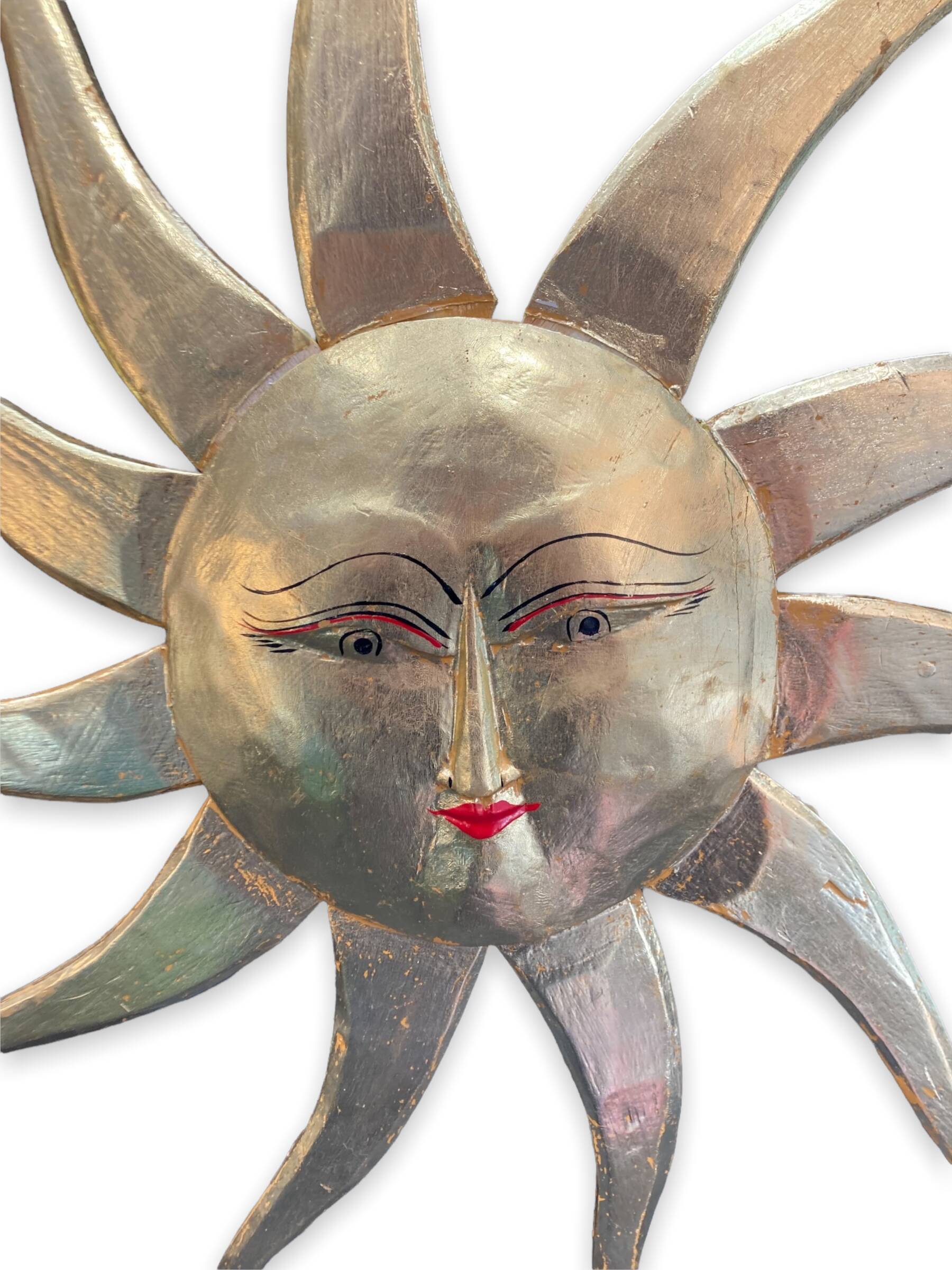 Sun in gilded wood