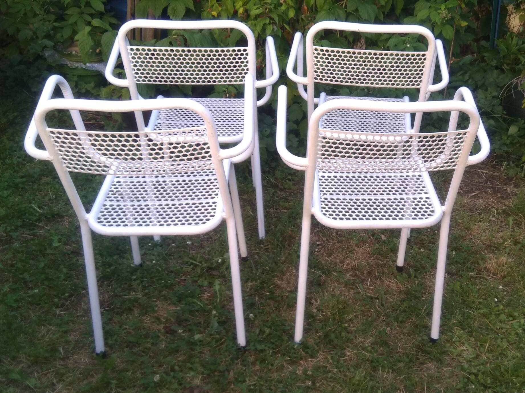 Set of 4 stackable perforated garden armchairs
