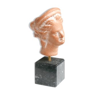 Woman's head on marble base, 70s