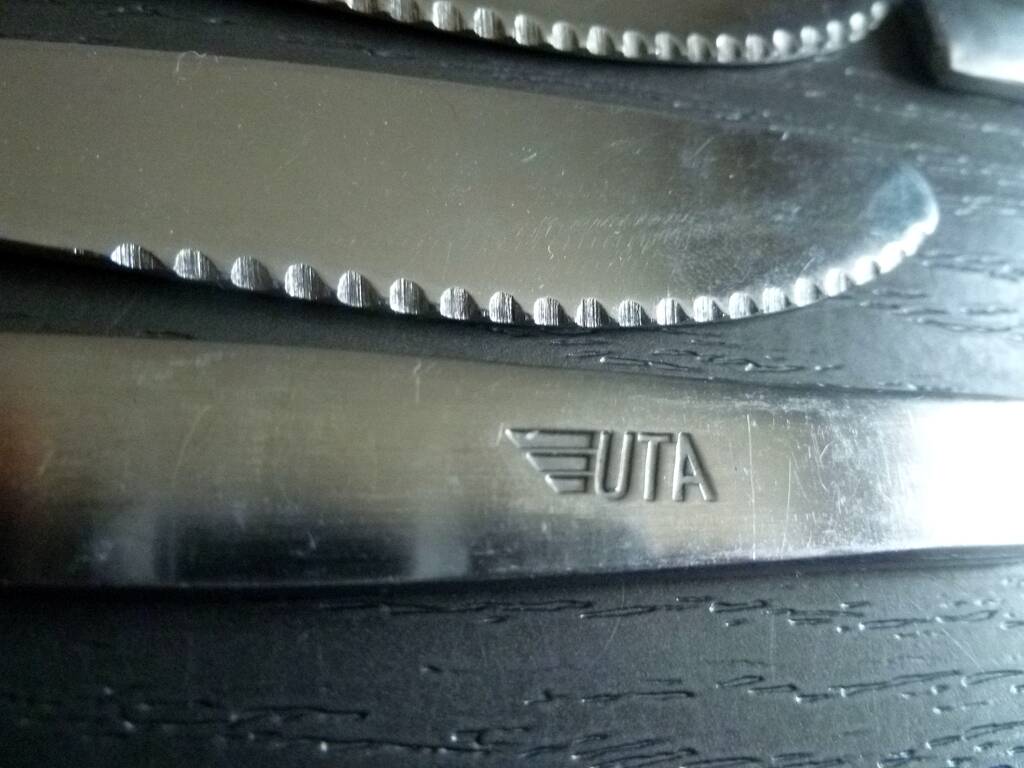 Set of 12 UTA stainless steel knives, vintage