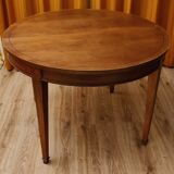 Round cherry table with extension, 3 chairs and 1 armchair.