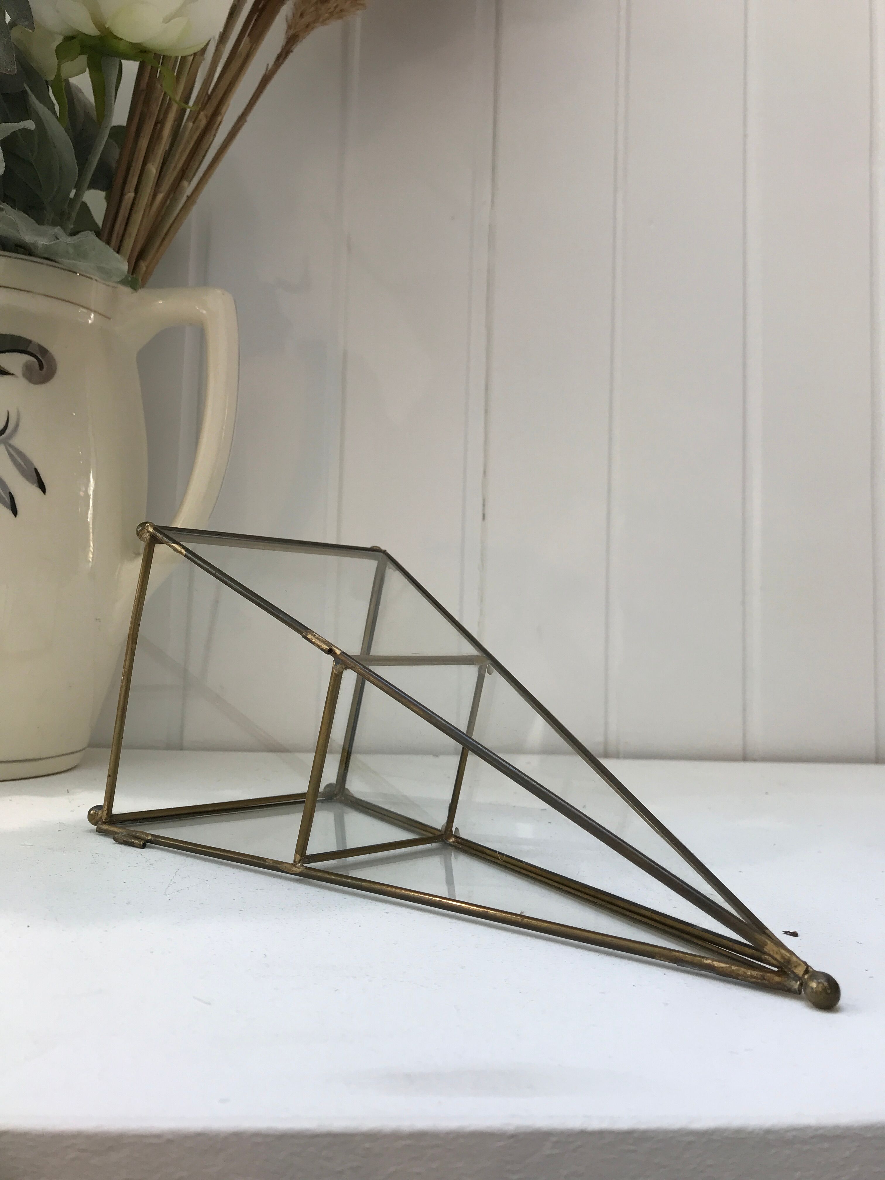 Brass pyramid showcase