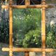 Turned wooden mirror in bamboo style from the 1930s.