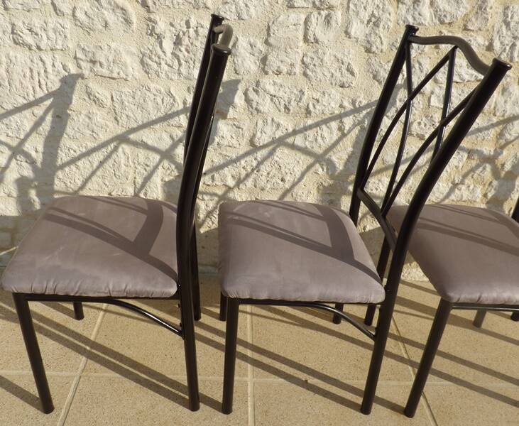 4 black metal chairs with high backs and gray suede tops