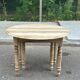 Round extendable dining table with flaps, stripped in raw oak, with 4 extensions.