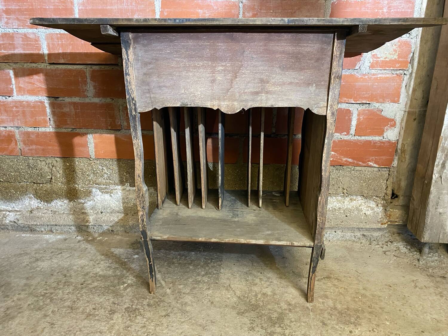 Antique writing desk, blackened wooden filing cabinet.