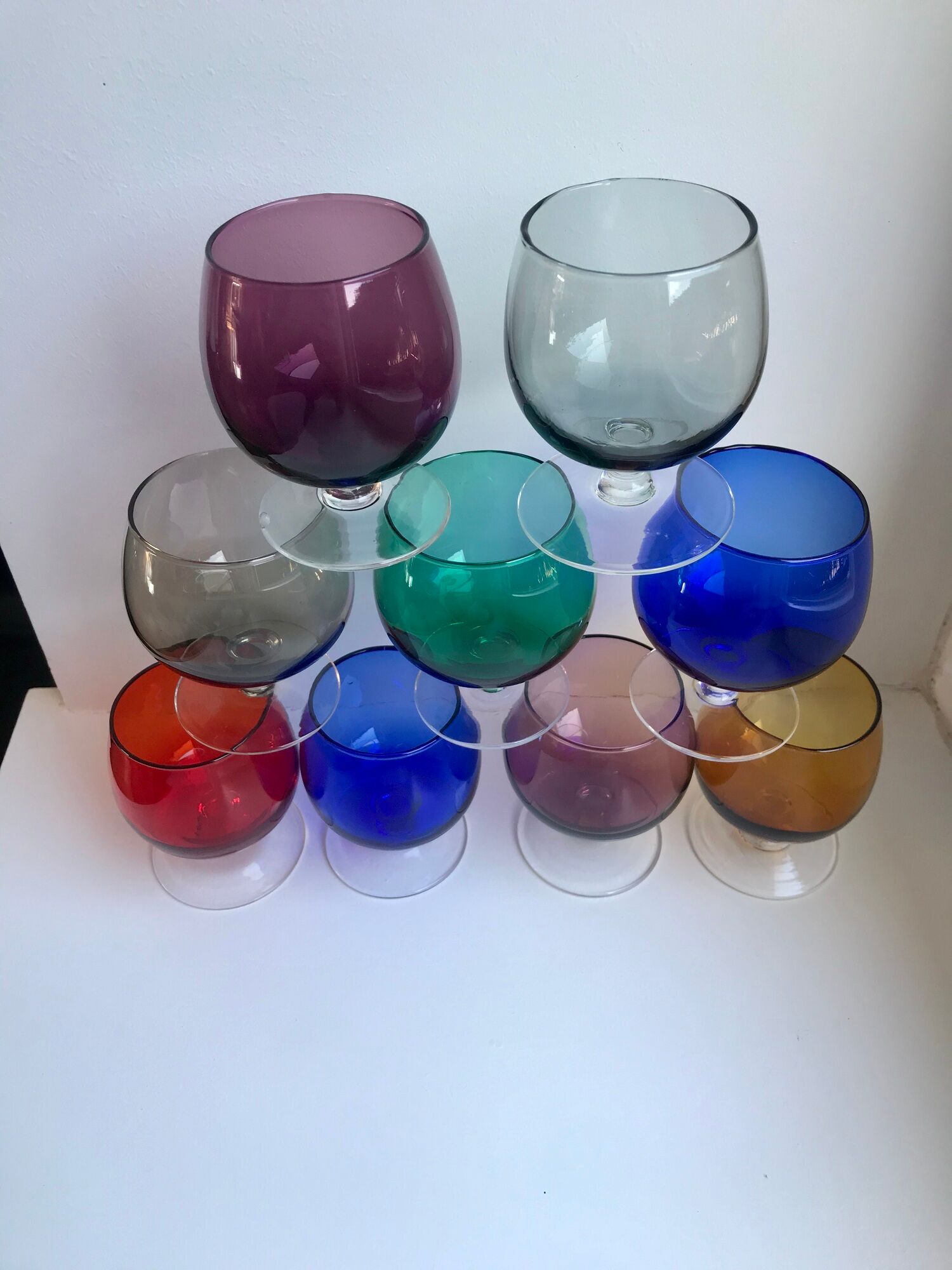Set of 9 glasses with colored feet in blown glass 50s