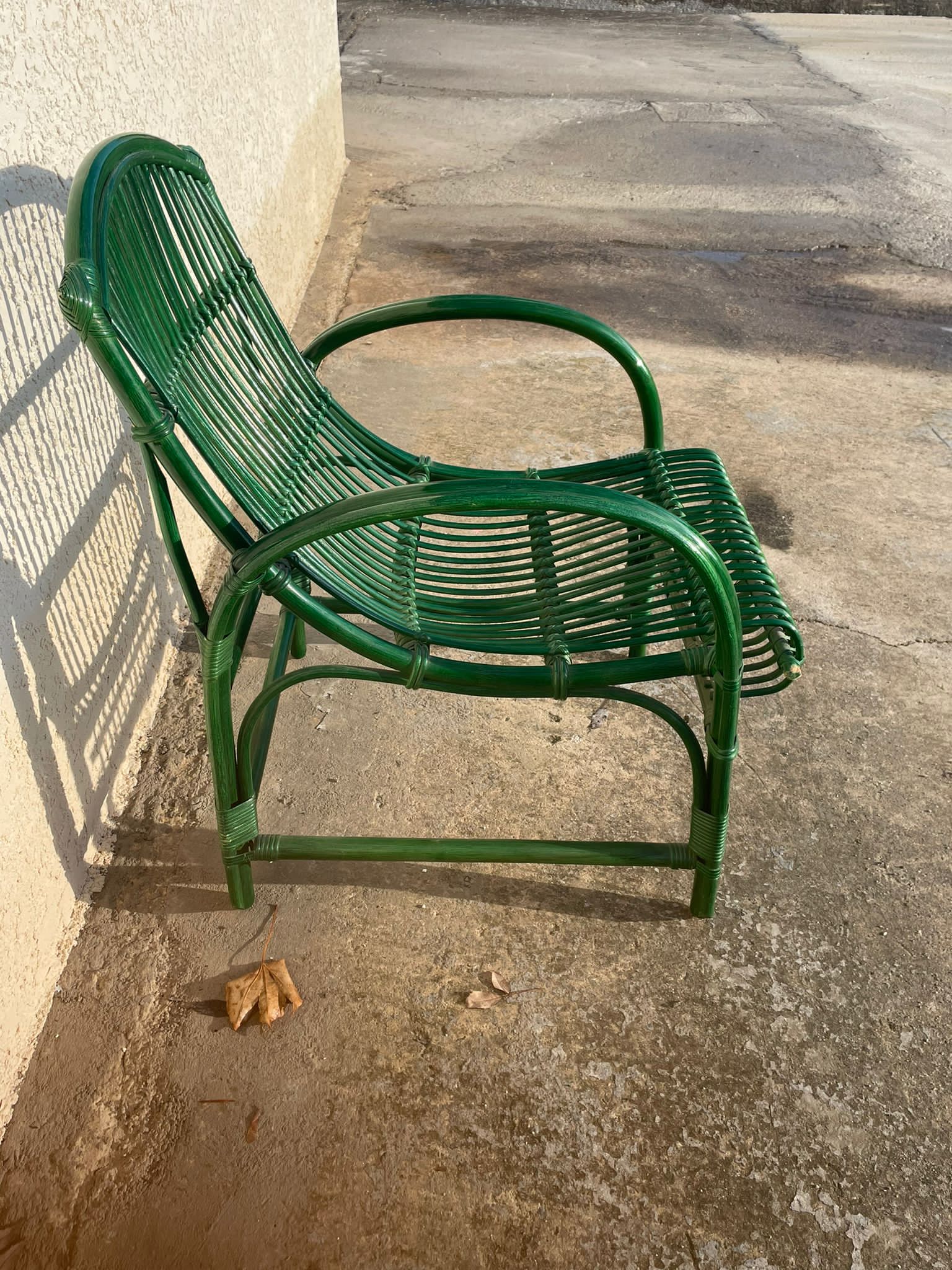 Green rattan armchair