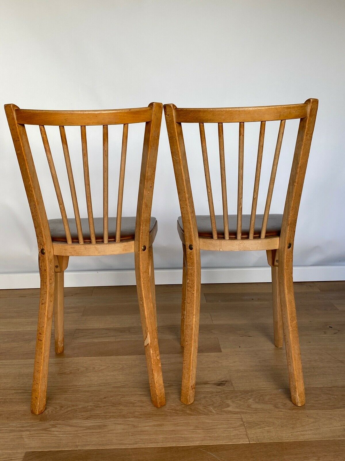 Four chairs Baumann 1960 with bars seated skaï brown label