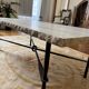 Table basse en travertin et piétement en fer forgé