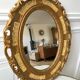 Miroir ovale médaillon en stuc doré années 70