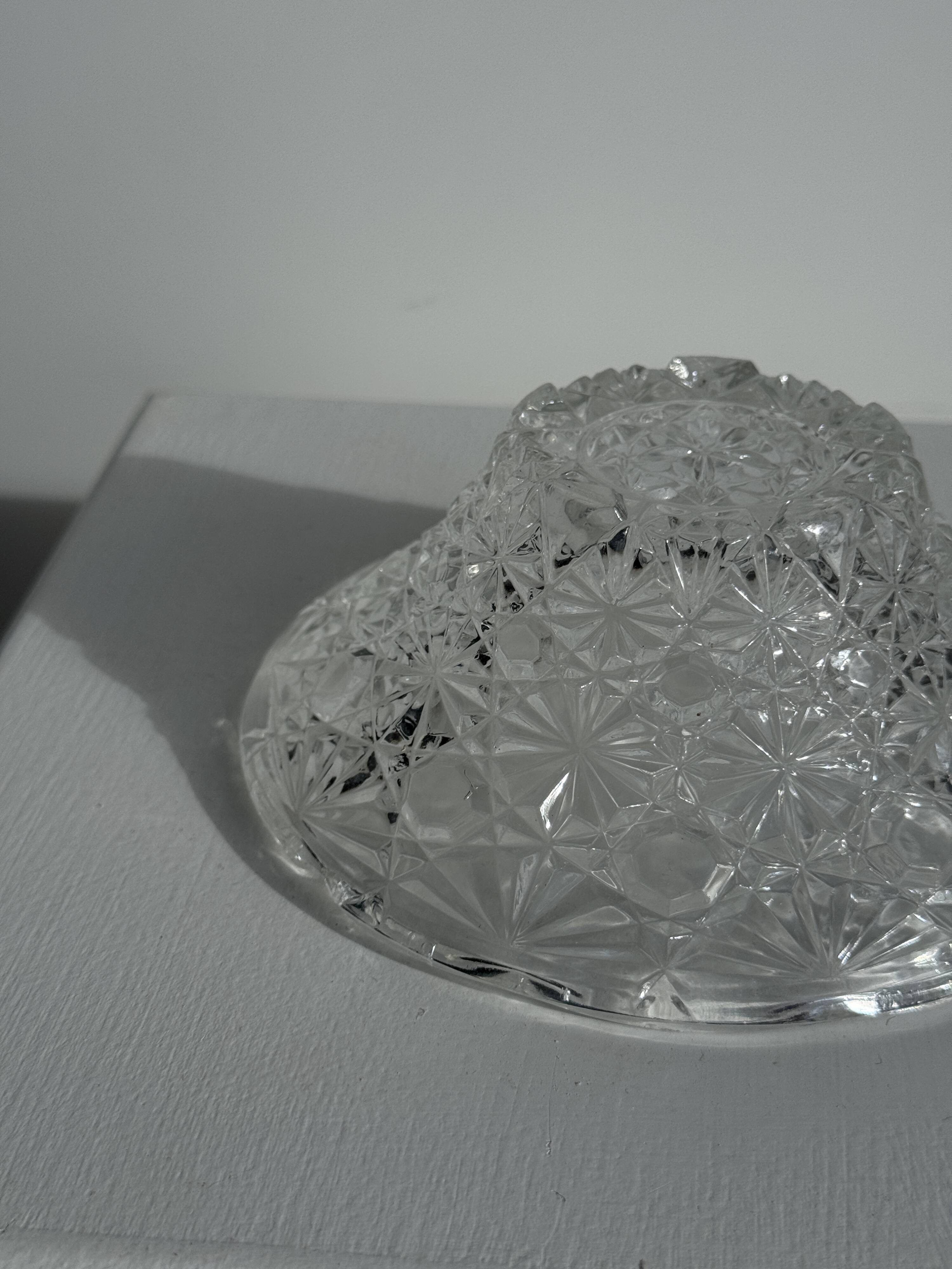 Small glass dish with vintage diamond points, a sparkle.