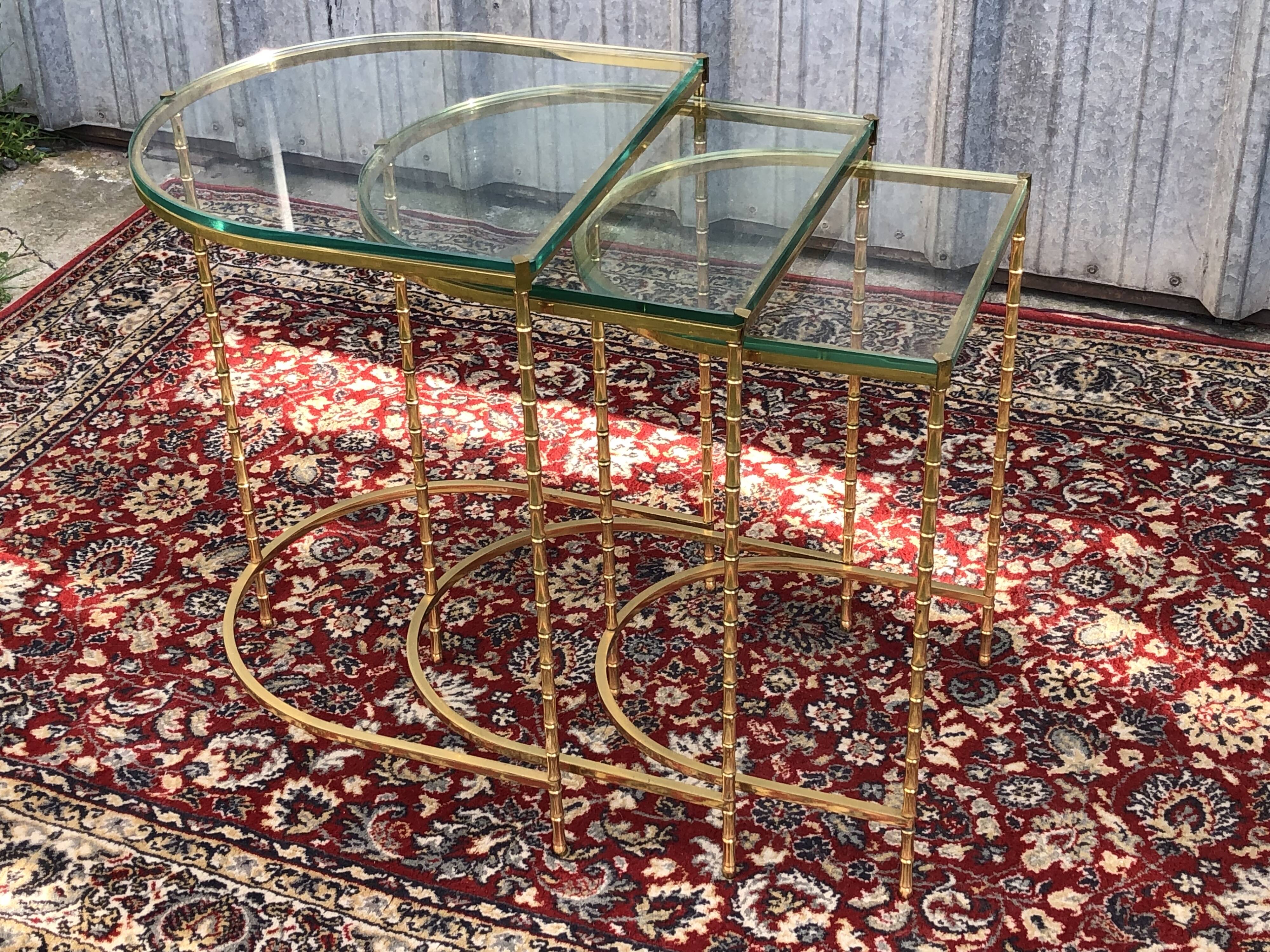 Suite of 3 trundle tables in golden brinze and glass slabs period 1970/1980