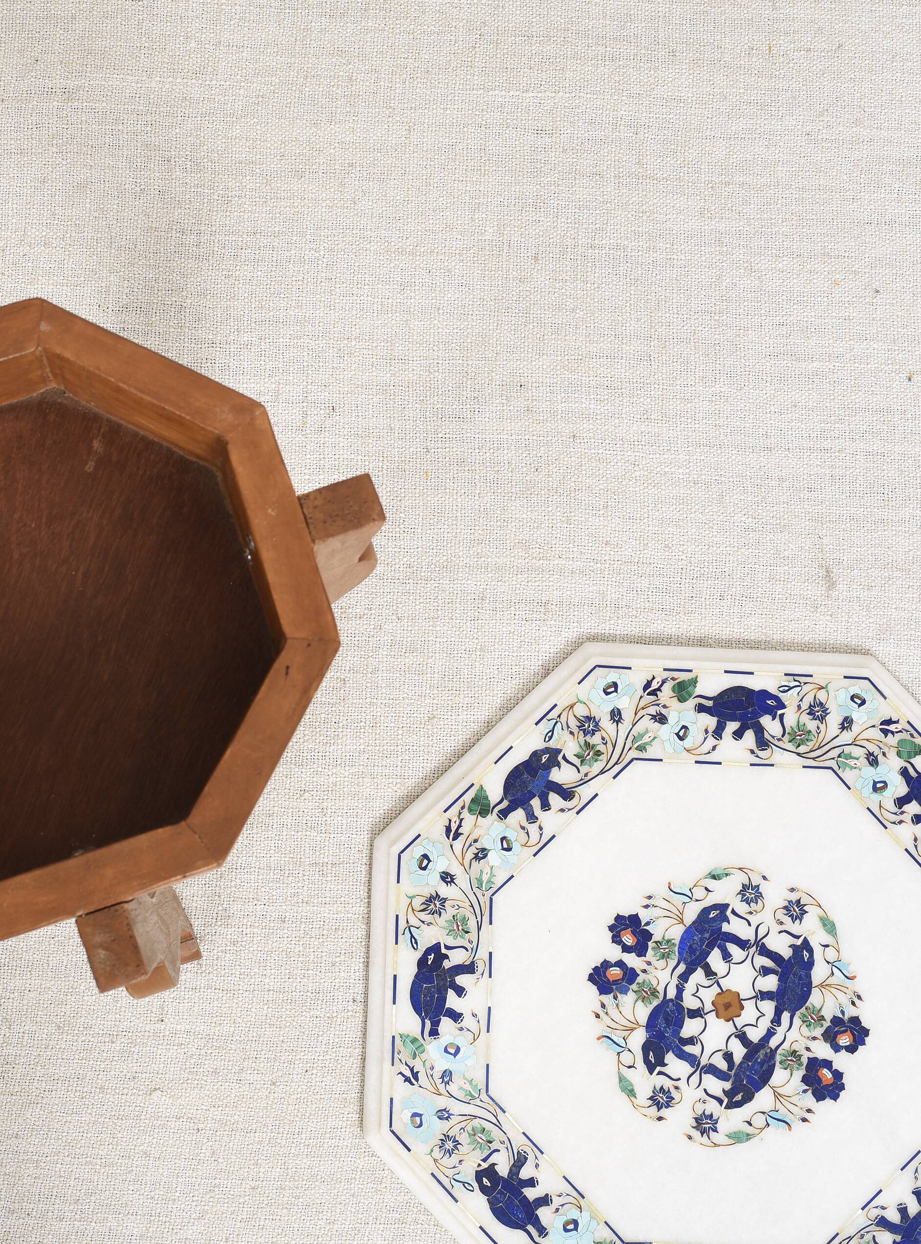 Side table with marble top and inlaid stones