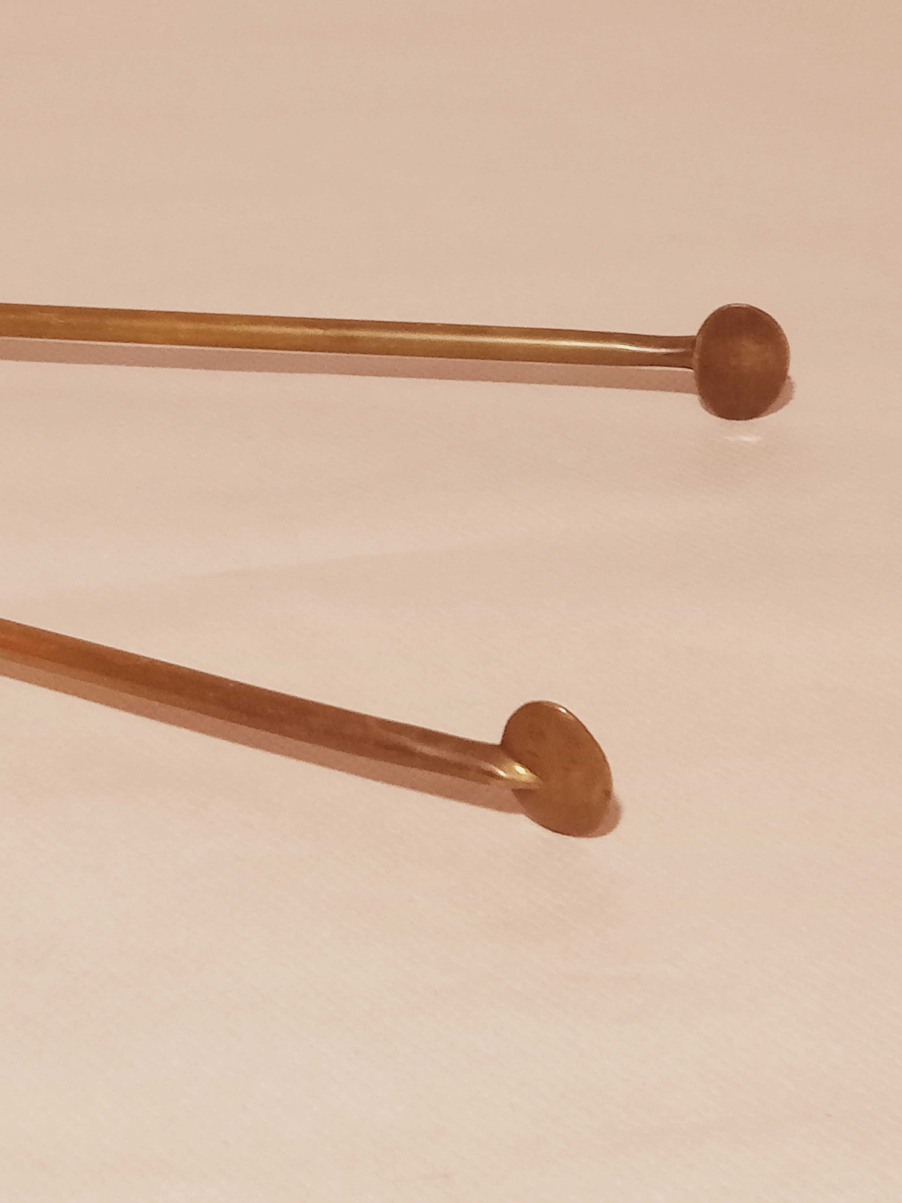 Old bronze or brass fireplace clamp