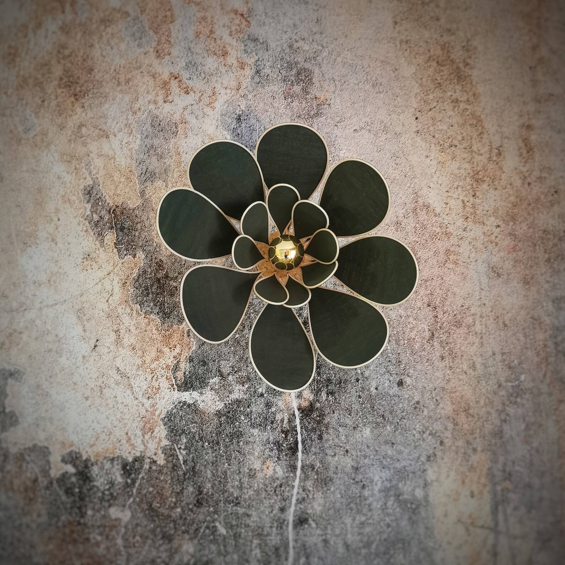 Flower wall light made of rattan and fir green linen petals