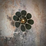 Flower wall light made of rattan and fir green linen petals