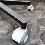 Stool on metal stand in star on wheels sitting round padded skaï bluish