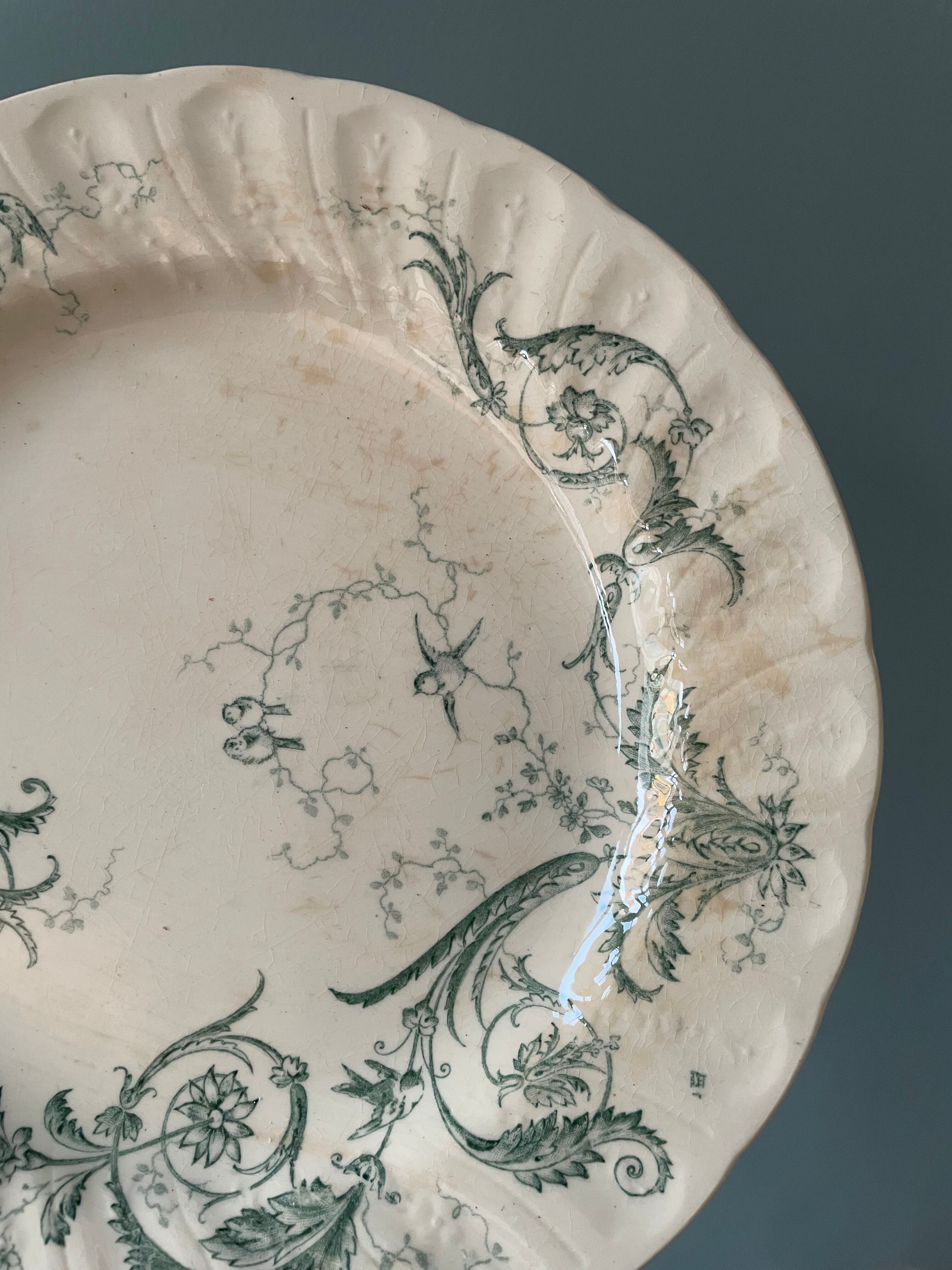 Set of 12 flat plates Terre De Fer XIXth in opaque porcelain of Gien, model Rinceaux