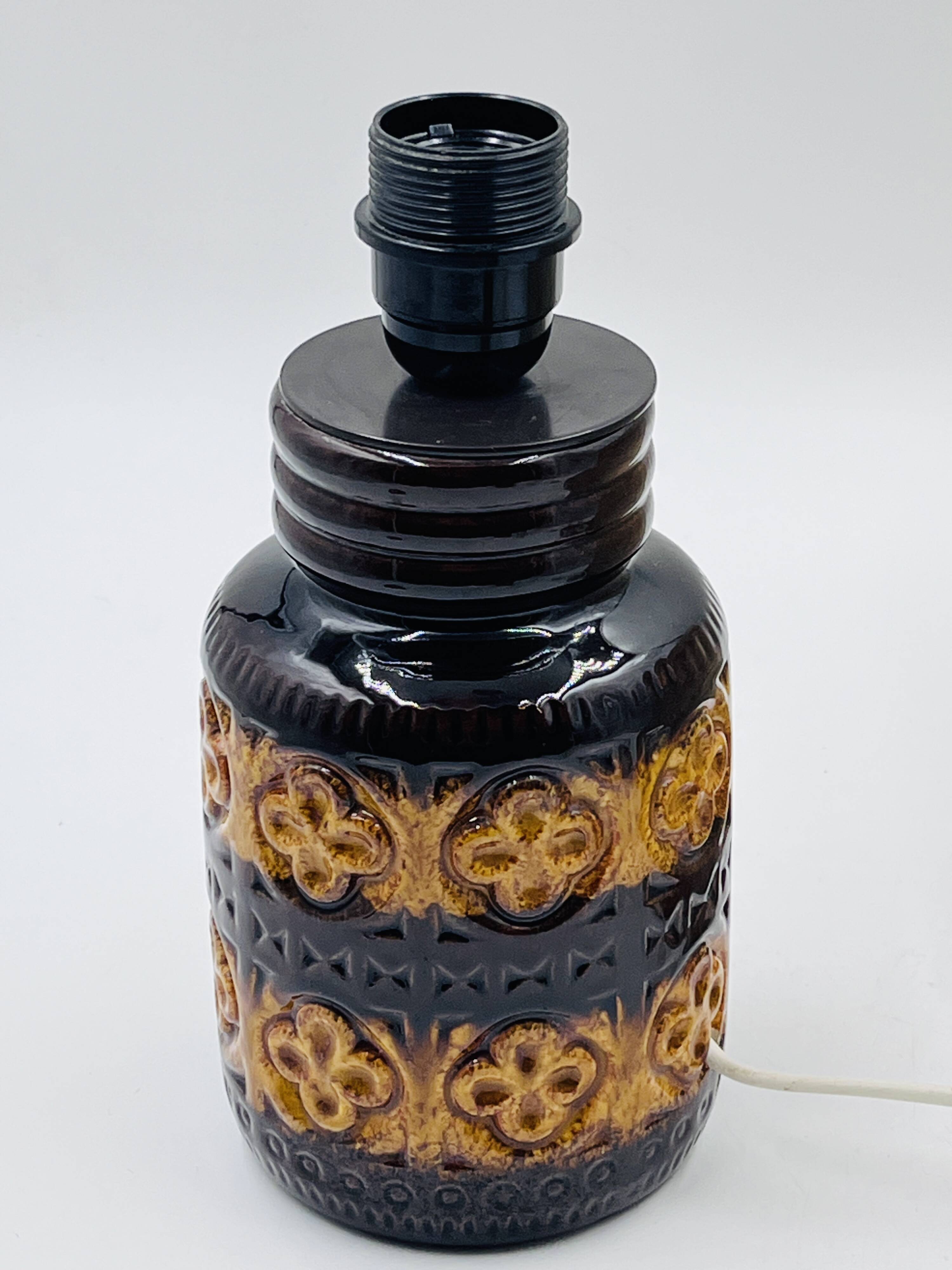 Vintage ceramic lamp with relief and wool shade.