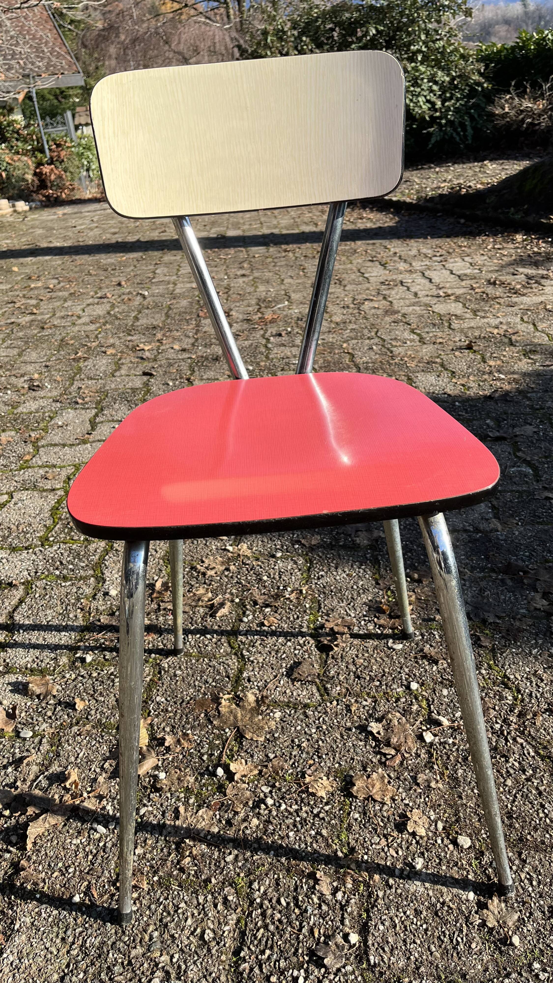 Red and cream Formica kitchen chairs