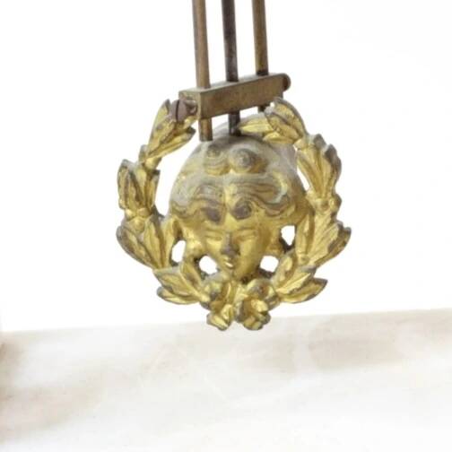 Clock and pair of Louis XVI style candelabras.