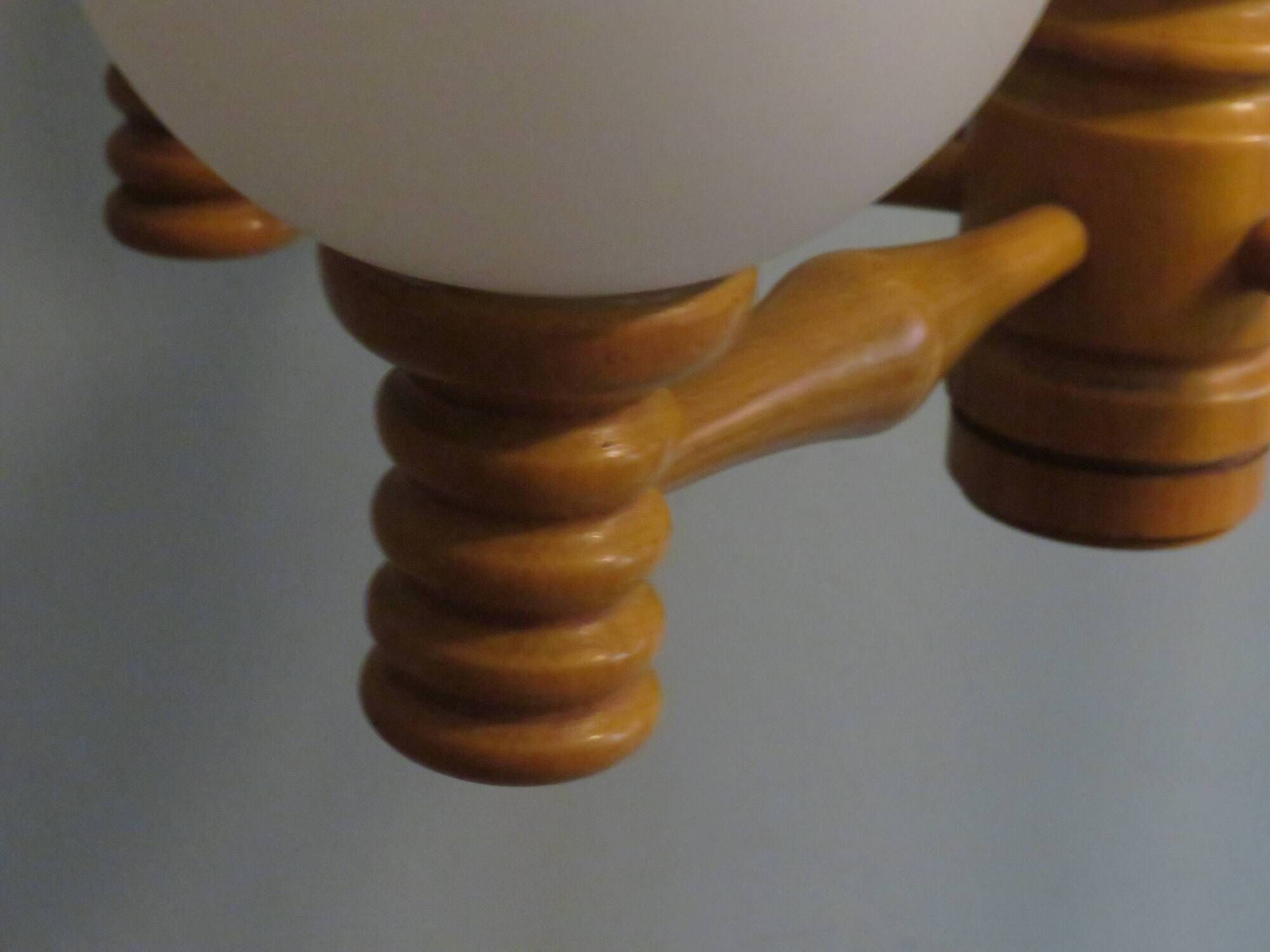 Space age chandelier in 5-arm wood with white frosted opaline glass spheres.