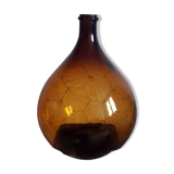 Great old demijohn in amber glass