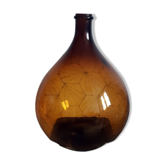 Great old demijohn in amber glass