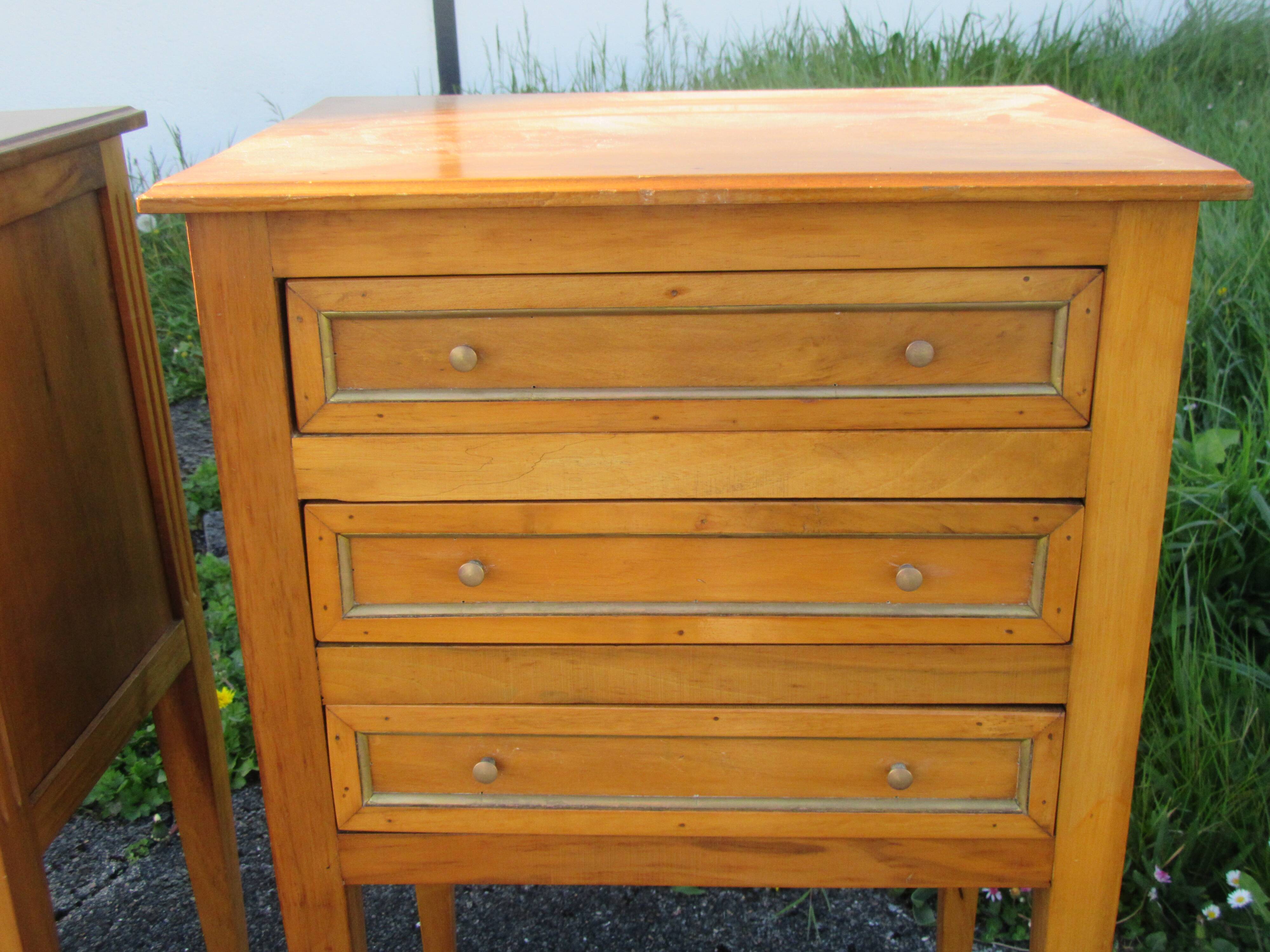 Pair of walnut bedside tables in Louis XVI style with brass inlay.