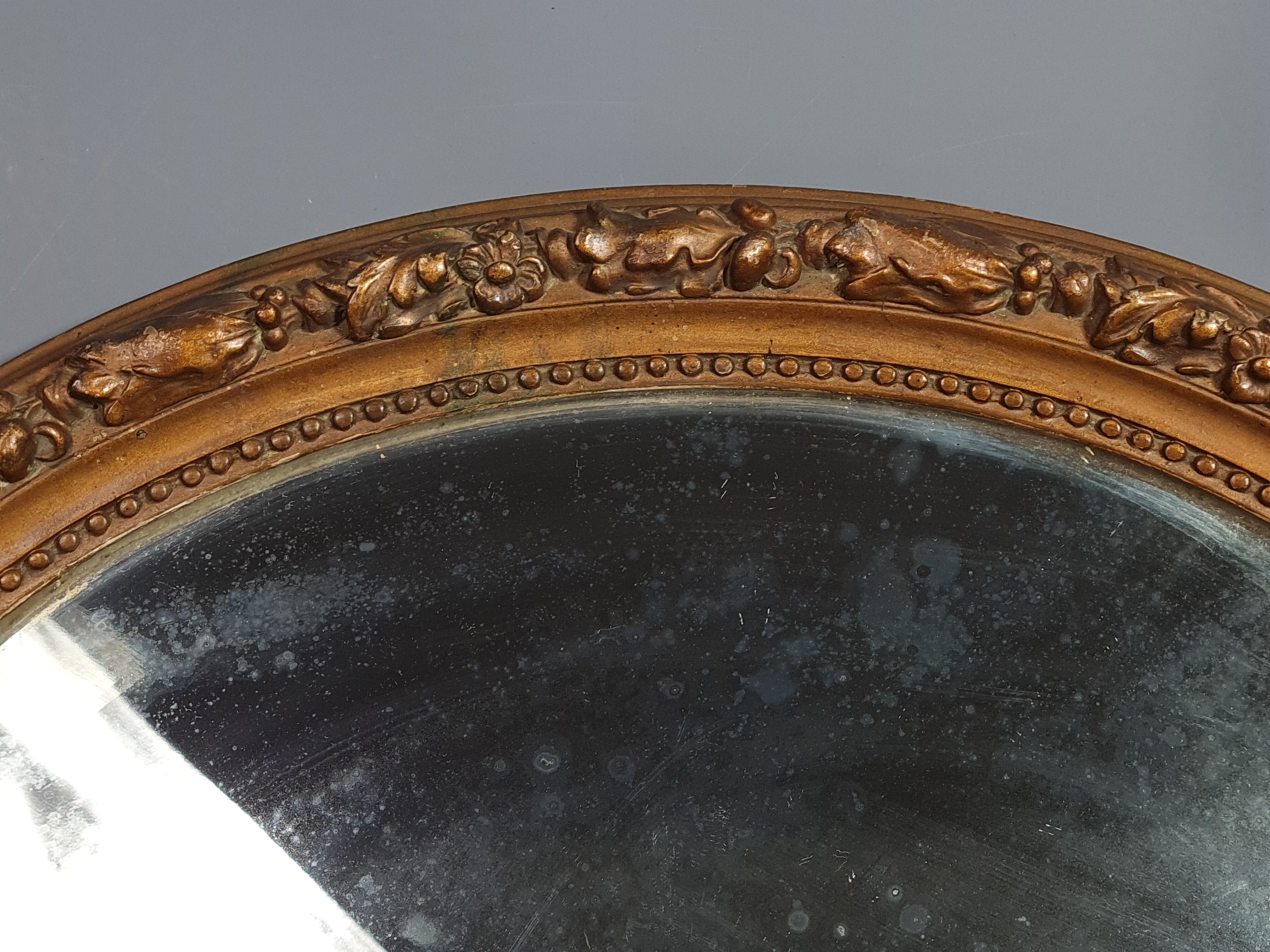 Old oval mirror beveled wooden frame & gilded stucco 50x40 cm 1900