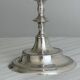 Silver-plated metal stand.